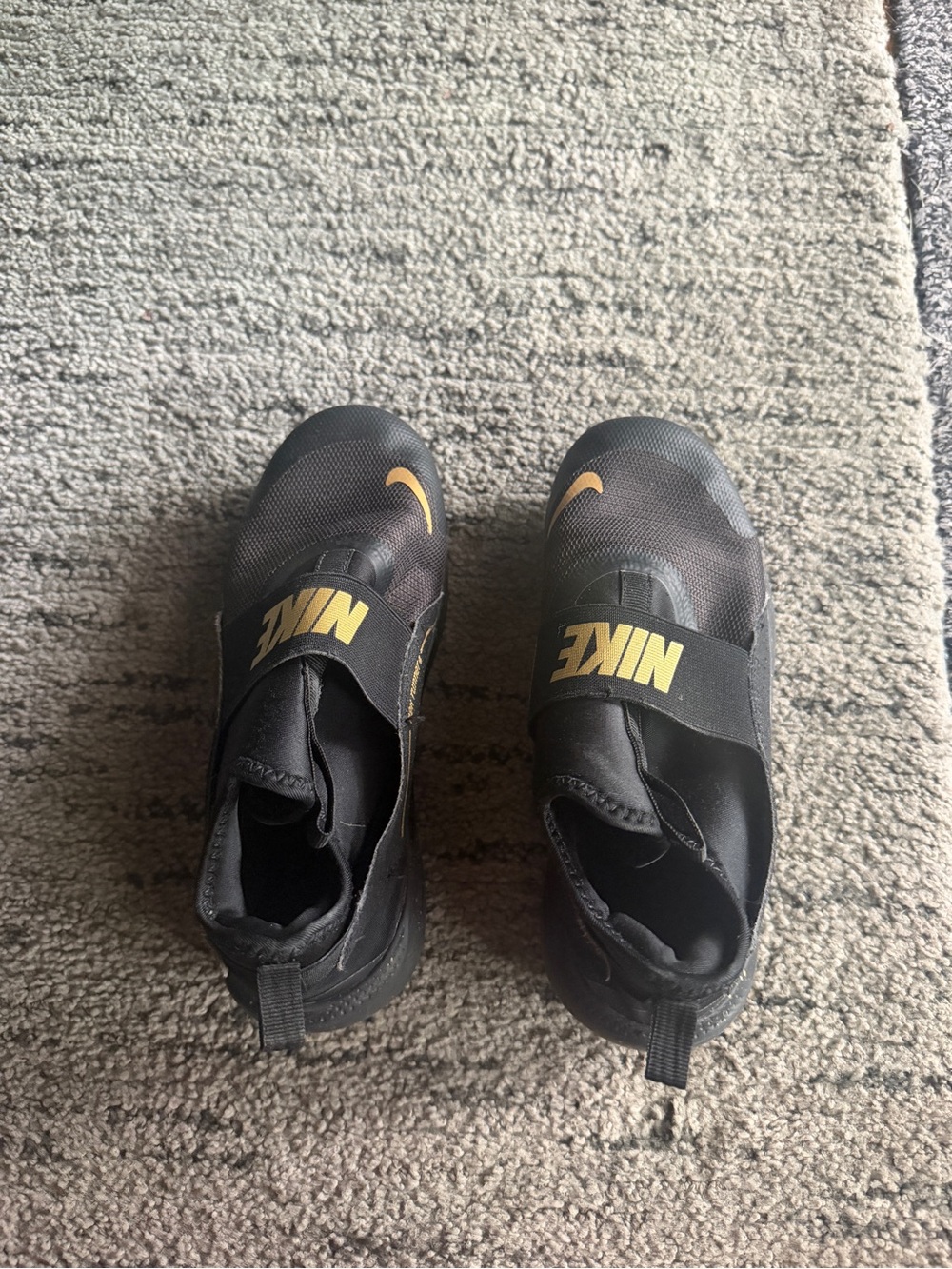 Nike Black Slip-On Trainers with Gold Logos
